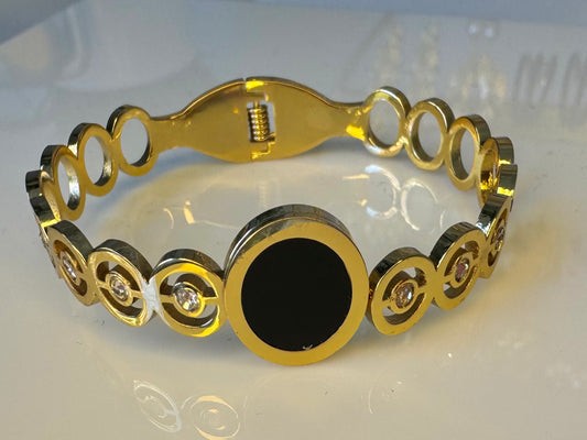 BRAZALETE DE CHISPAS Y ARO NEGRO