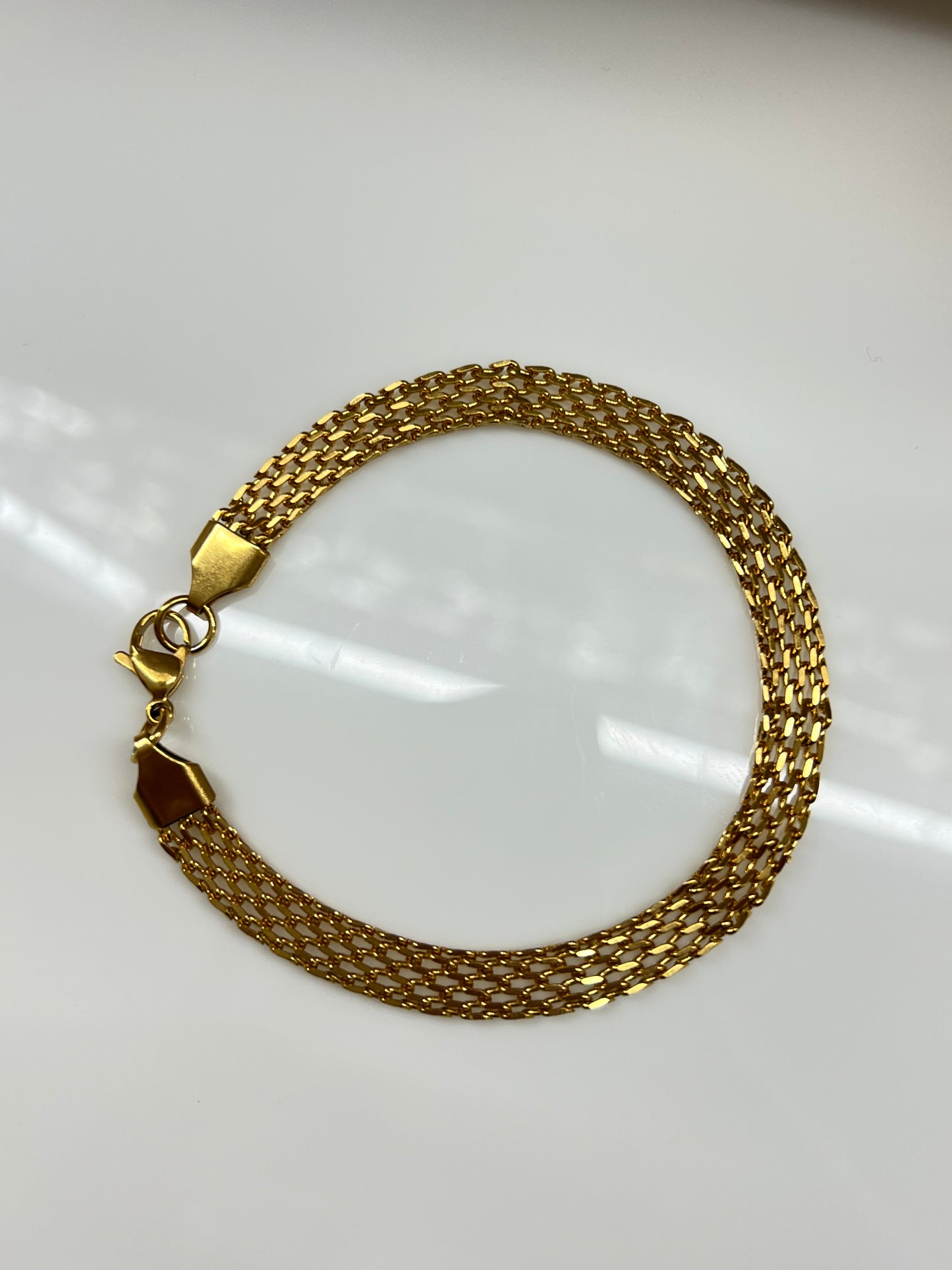 MANILLA CADENA PLANA ANCHA DORADA